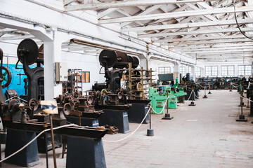 Old machinery from the 19th century to treat metal, exhibited in a museum.