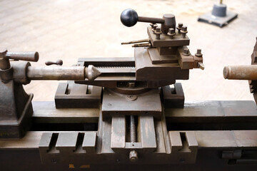 Old tools and manual presses to work the metallic material.