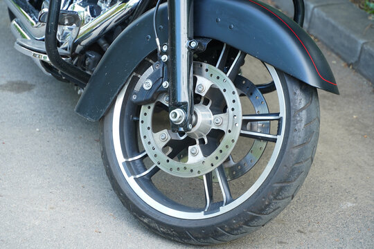 front wheel on a Harley Davidson motorcycle. Harley-Davidson, Inc., H-D, or Harley, is an American motorcycle manufacturer founded in 1903 in Milwaukee, Wisconsin. photo taken in the spring of 2022. 