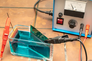 galvanic electrolysis of the solution with power supply