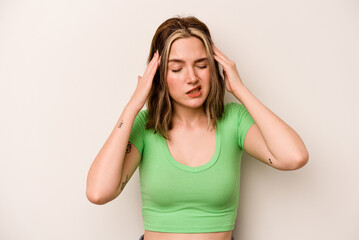 Young caucasian woman isolated on white background touching temples and having headache.