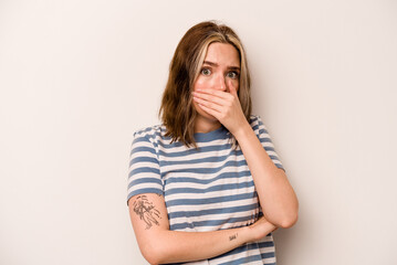 Young caucasian woman isolated on white background scared and afraid.