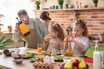 Family preparing food in kitchen