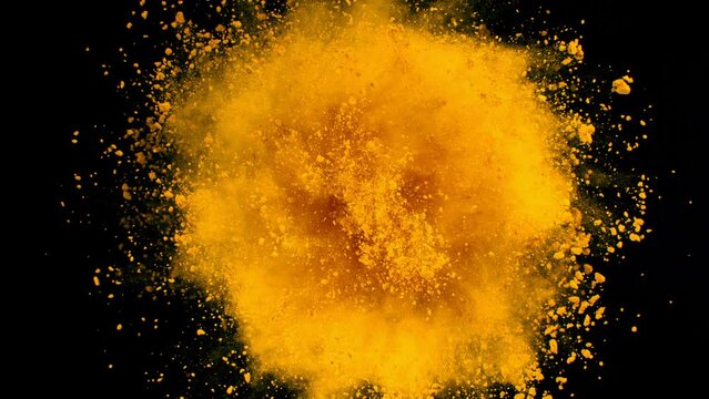 Super Slow Motion Shot of Rotating Yellow Powder Expolosion Isolated on Black Background at 1000fps.