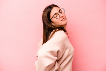 Young caucasian woman isolated on pink background suffering a back pain.