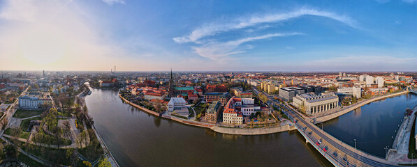 Obraz premium Aerial panorama of Wroclaw city with car bridge over Odra river in Poland, Urban cityscape with historical european architecture