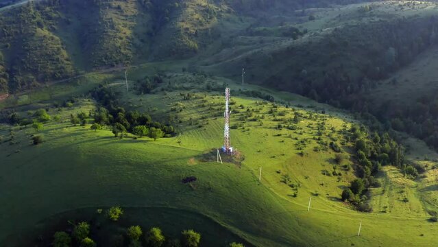 Telecommunication transmission tower high in the mountains. 5g 4g LTE internet signal
