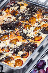 plum pie with poppy seeds and crumble
