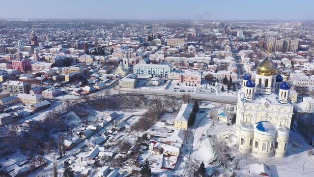 Aerial view of the Ascension Cathedral, located in the historical center of the city on the Red Square of Yelets, and the surrounding his residential areas in winter, Russia. 