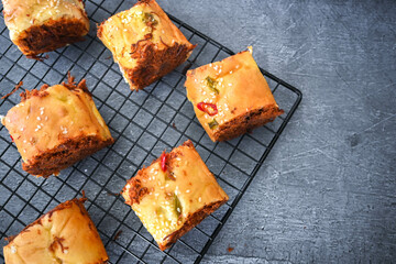 Indonesian snack, Roti gulung abon ikan tuna or Shredded tuna roll on a white folding plate.