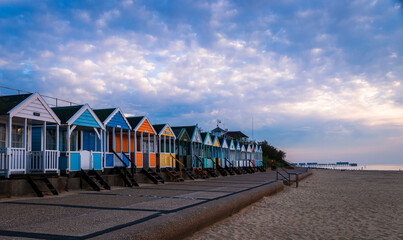 Beach huts along the seafront on an early morning in May at Southwold Suffolk East Anglia England