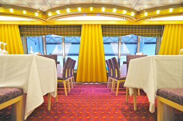 Elegant formal Lounge Bar Restaurant dining room on luxury cruise ship liner club interiors