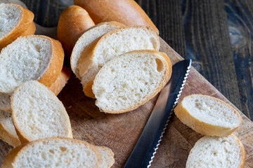 wheat baguette cut into pieces on a cutting board