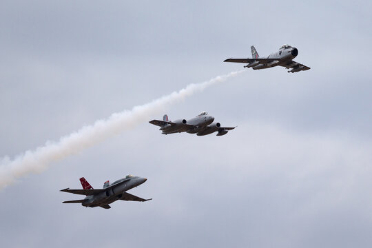 Avalon, Australia - February 28, 2015: Former Royal Australian Air Force Commonwealth Aircraft Corporation CA-27 Sabre (F-86 Sabre) jet aircraft leading a Gloster Meteor and an F/A-18 in formation.