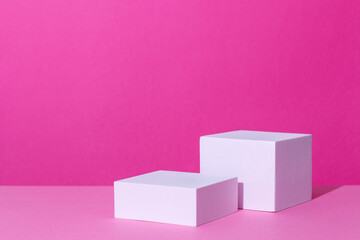 Empty podium or stand for product showcase on pink background