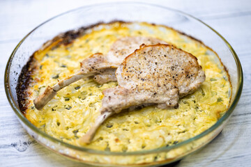 seared pork chop roasted on creamy onion