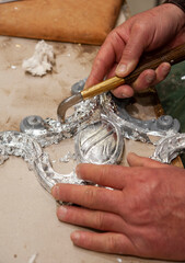 Silvered frame ready for burnishing with an agate stone tool. Silvering process technique..