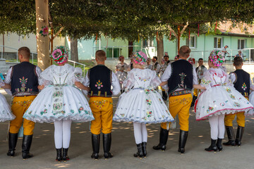 Rakvice, Czech Republic - June 2021. Beautiful women and men dancers in a celebration.Traditional...