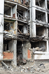 Fototapeta na wymiar Destroyed residential building after shelling