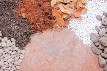 Pumice pebbles ,Volcanic rock, Dry leaves ,White perlite,Coconut coir and Soil ,ingredients for plant