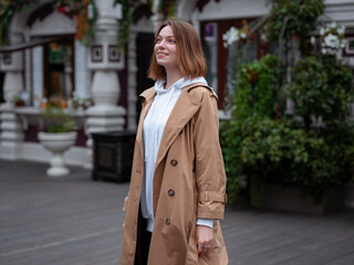 Obraz premium Beautiful woman walk in autumn cloudy Moscow. Street style. Travel to Russia concept.