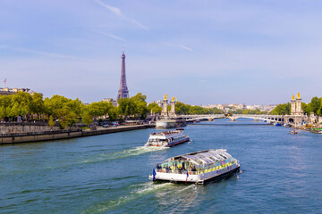 Tourist Boat On Seine River In Paris Europe With Eiffel Tower In Background.