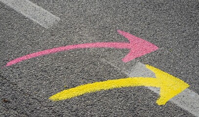 Painted arrow signs on street.  Abstract background with space for text.