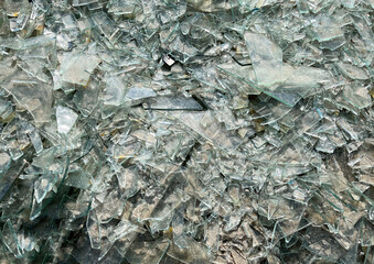 Background of broken glass close-up. The texture of broken glass