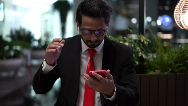 Young businessman in suit asleep and startled when someone called.