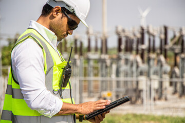 engineer team working in wind turbine farm. Renewable energy with wind generator by alternative energy concept.