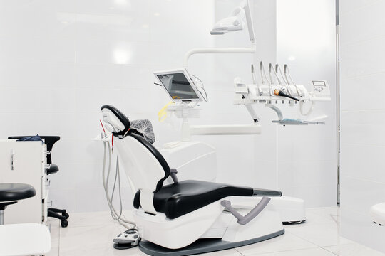 Dentist's Dental Office Interior With Unit, Tools, Lamps, Ergonomic Chair