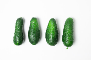 Small cucumbers isolated on white background. Fresh homemade cucumbers