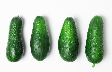 Small cucumbers isolated on white background. Fresh homemade cucumbers