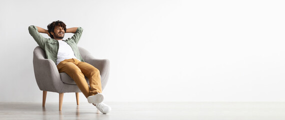 relaxed handsome dark-skinned guy looking at copy space