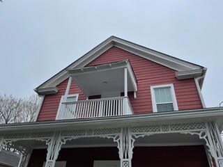 Old historic top of home red and white wooden building