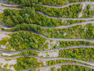 Aerial view on the Old Road serpentine in the national park Lovcen, Montenegro - obrazy, fototapety, plakaty