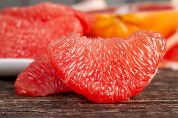 peeled and divided into parts ripe red grapefruit