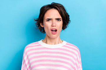 Portrait of young disappointed lady staring no believe impossible news grumpy face isolated on blue...