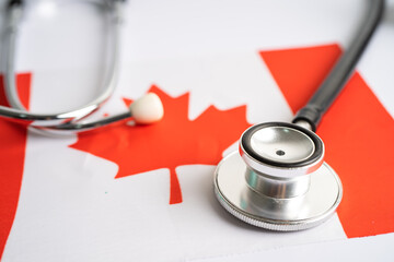 Black stethoscope on Canada flag background, Business and finance concept.