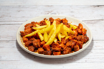 Pork meat with chips and spices