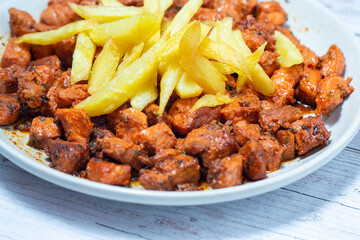 Pork meat with chips and spices