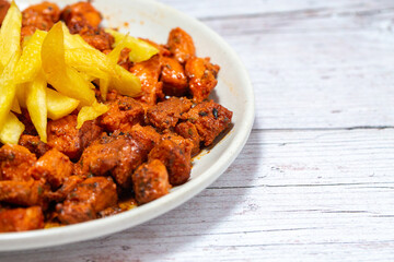 Pork meat with chips and spices