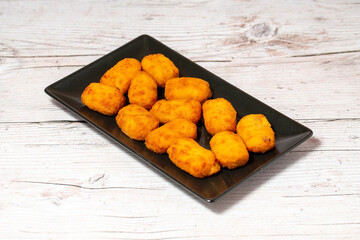 homemade ham croquettes on wood