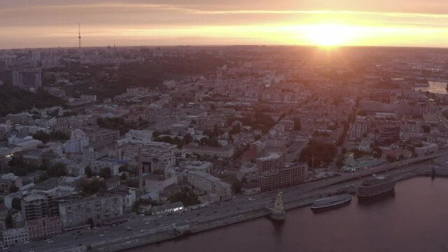 Podol is an old district of the city of Kyiv. Sunset. Summer. Roofs of houses. Aerial. Сity ​​skyline
