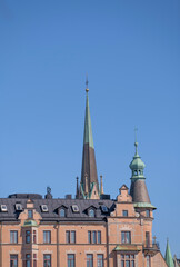 Fototapeta na wymiar Tower and roofs a sunny spring day in Stockholm