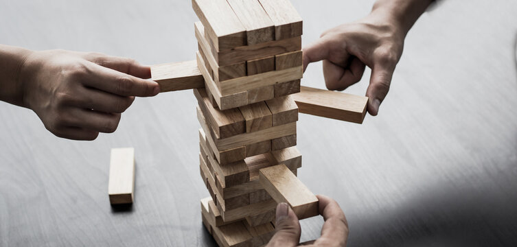 Planning to reduce investment risks, plan and strategy in business, Establishing a business risk mitigation plan to create stability for the company, Business growth with wooden blocks concept.