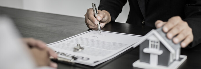 Real estate agent holds the keys to send to the client and offers the conditions for signing the...