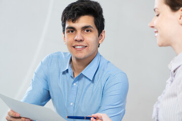 portrait of a young man at a business meeting