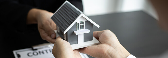 Real estate broker has given the house to customers who bought the house with insurance, Negotiating purchase-sale and investment planning concept.