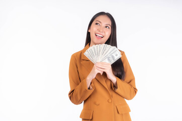 Successful beautiful Asian business young woman holding money US dollar bills in hand isolated on white background with copy space , business concept